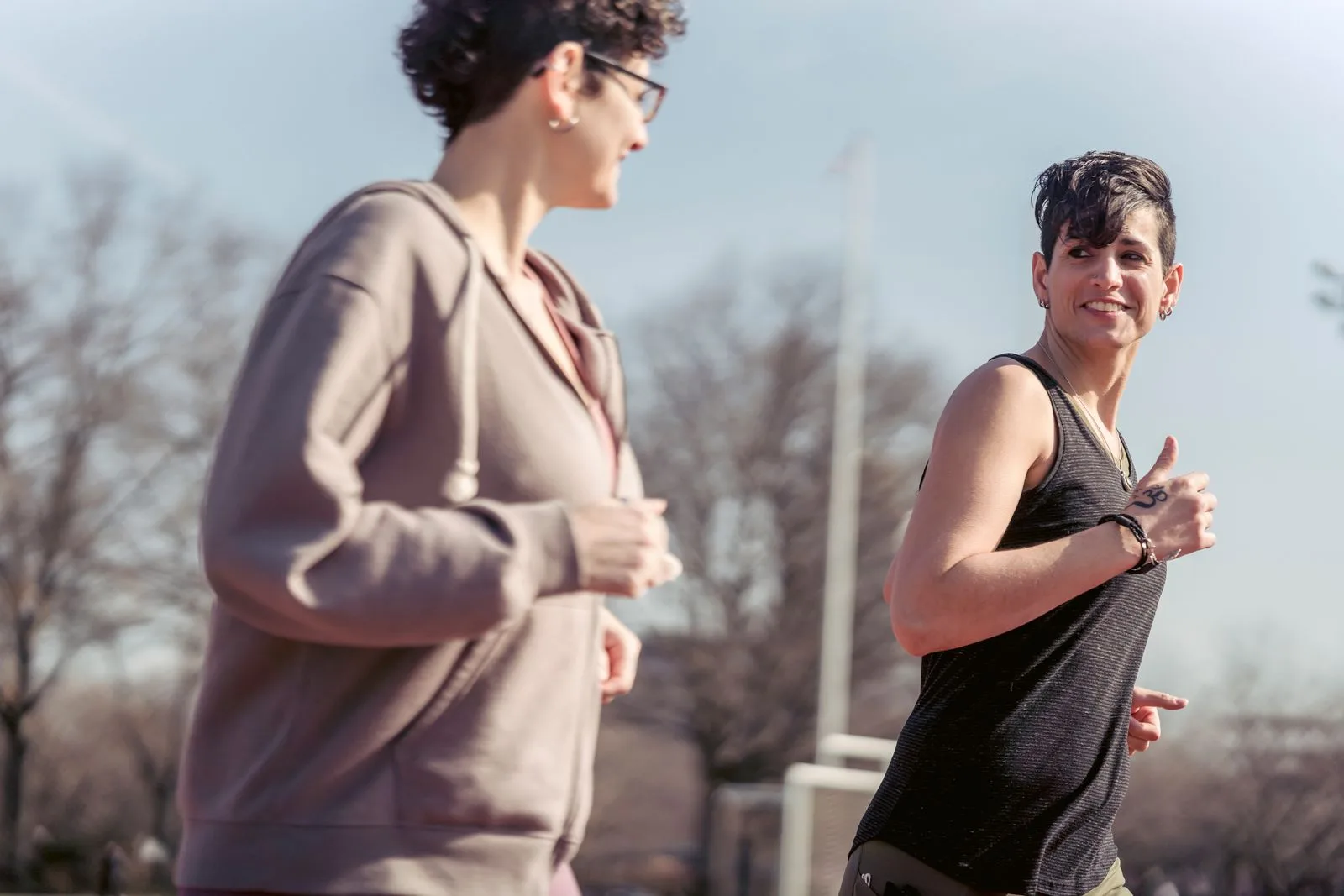 Two friends enjoying a run together in the sunshine